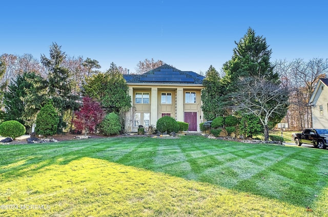 view of front of property featuring board and batten siding and a front yard