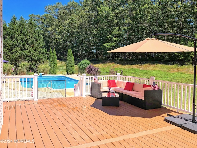 wooden terrace featuring a yard, an outdoor pool, and an outdoor hangout area