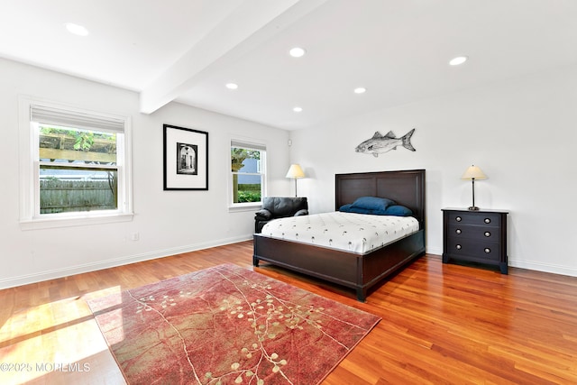 605 Broadway, Barnegat Light, NJ 08006 - bedroom with beamed ceiling, multiple windows, and wood finished floors