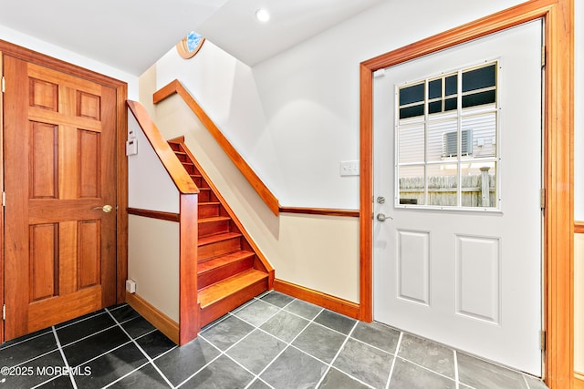 605 Broadway, Barnegat Light, NJ 08006 - entryway with dark tile patterned flooring, stairway, and baseboards