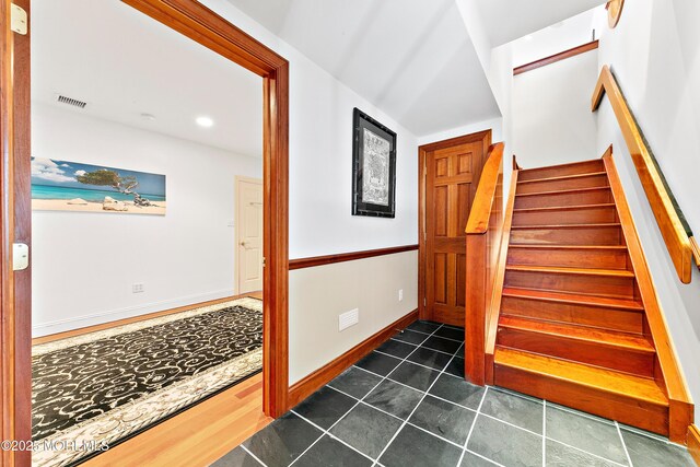 605 Broadway, Barnegat Light, NJ 08006 - stairway featuring tile patterned floors, visible vents, and baseboards