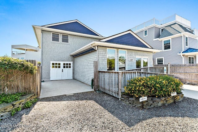 605 Broadway, Barnegat Light, NJ 08006 - shingle-style home featuring a patio, a garage, and fence