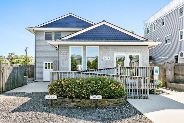605 Broadway, Barnegat Light, NJ 08006 - view of front of house featuring a wooden deck and fence