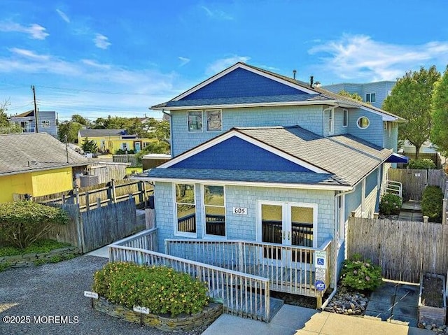 605 Broadway, Barnegat Light, NJ 08006 - view of front of property featuring roof with shingles and fence