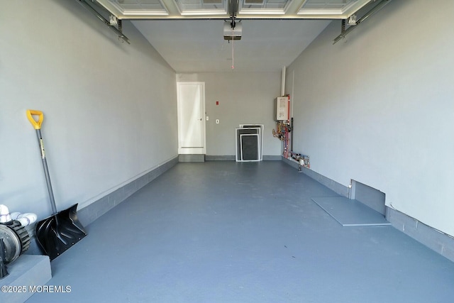 garage featuring a garage door opener and water heater