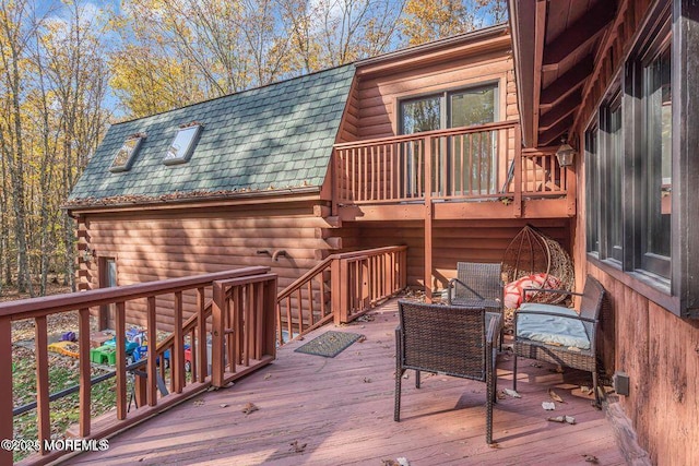 wooden terrace featuring an outdoor hangout area