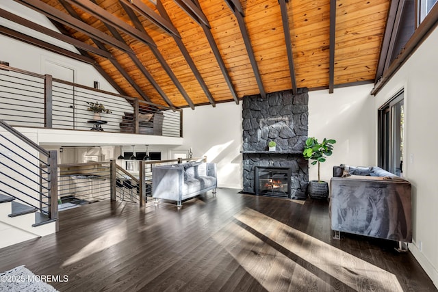 living area featuring dark wood finished floors, wood ceiling, beamed ceiling, a fireplace, and high vaulted ceiling