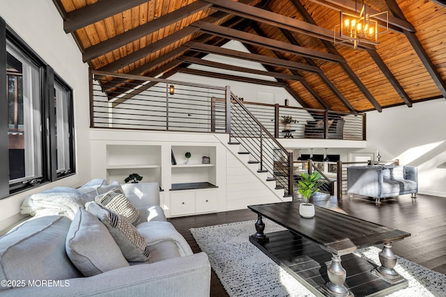 unfurnished living room featuring high vaulted ceiling, a notable chandelier, wood finished floors, wood ceiling, and beam ceiling