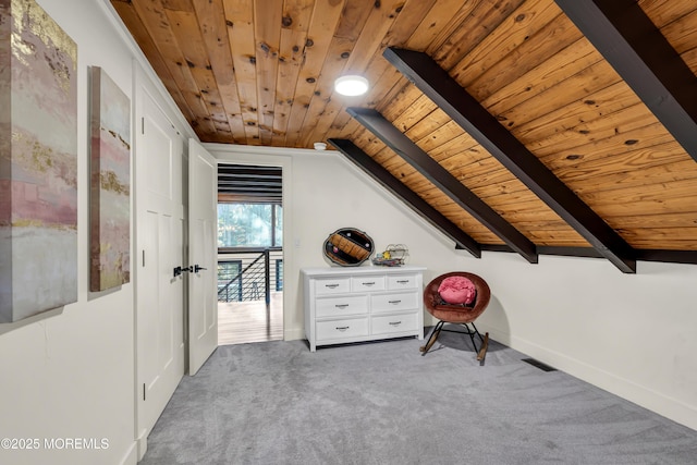 additional living space featuring lofted ceiling with beams, carpet floors, visible vents, and wood ceiling