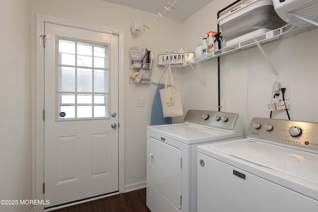 laundry area with laundry area, separate washer and dryer, and dark wood finished floors