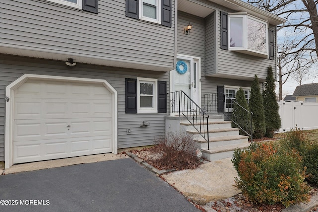 view of exterior entry featuring a garage