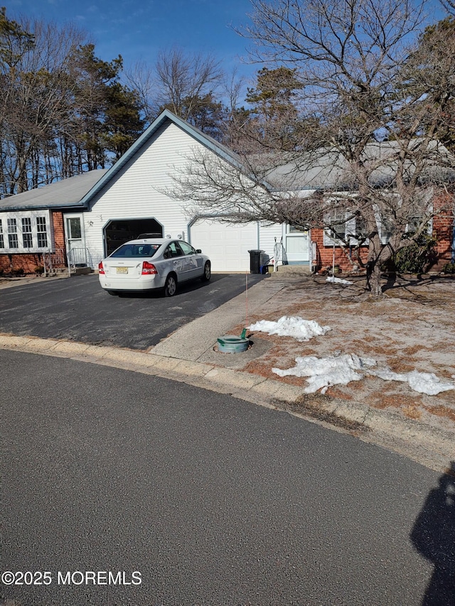 exterior space featuring a garage and driveway