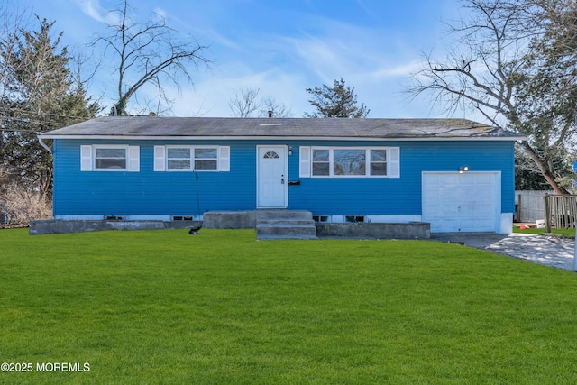 ranch-style house with a garage, a front lawn, and aphalt driveway