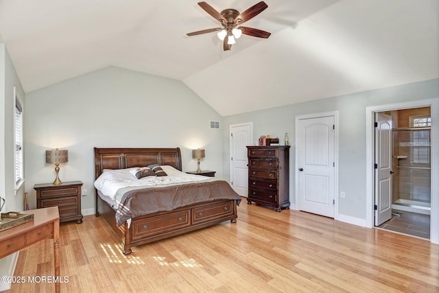 bedroom with lofted ceiling, baseboards, visible vents, and light wood finished floors