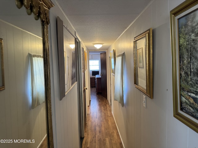 hall with dark wood-style flooring