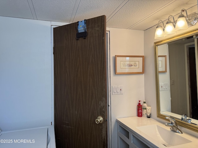 bathroom featuring vanity and a textured ceiling