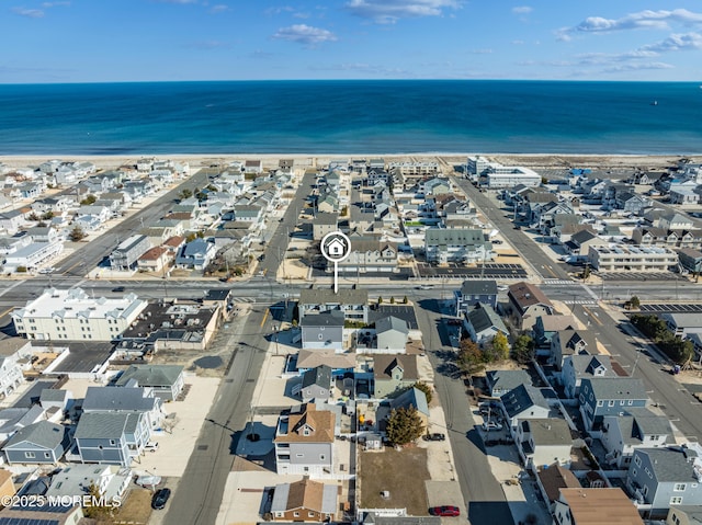 birds eye view of property with a water view and a residential view