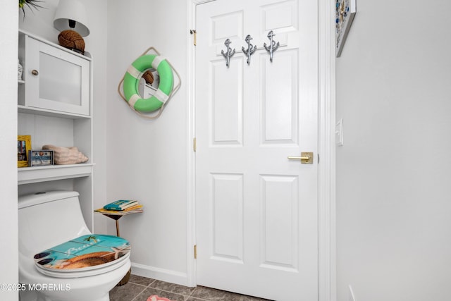 interior space with baseboards and tile patterned floors