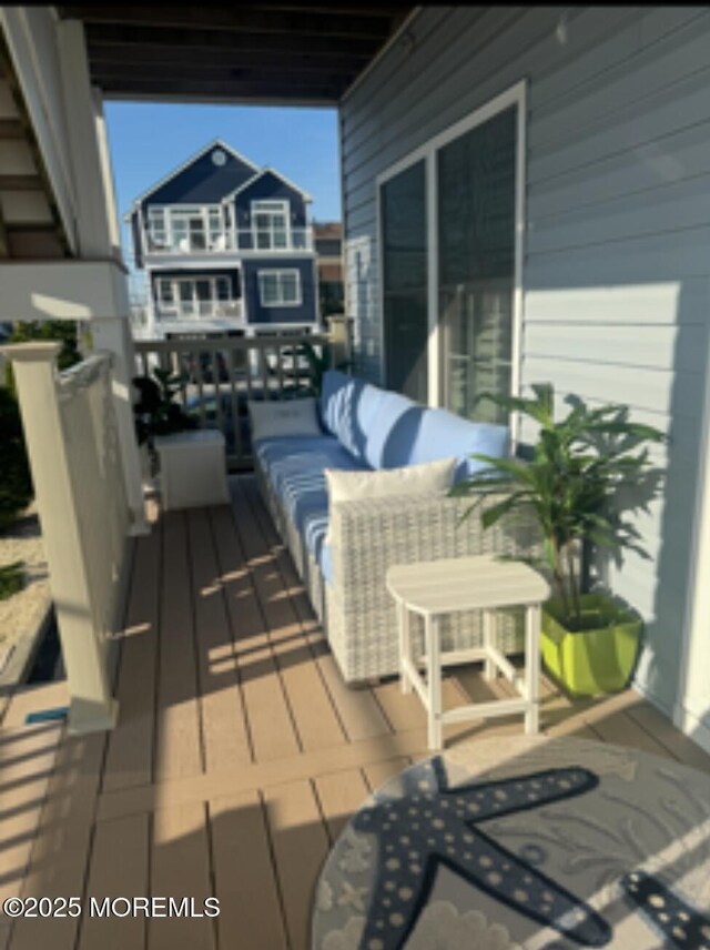 deck with an outdoor hangout area