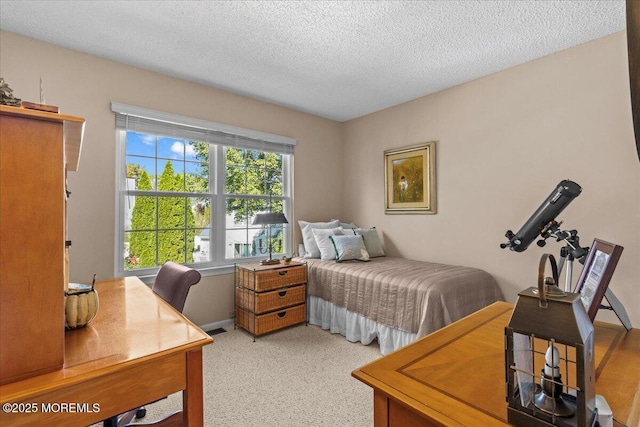 bedroom featuring visible vents and a textured ceiling