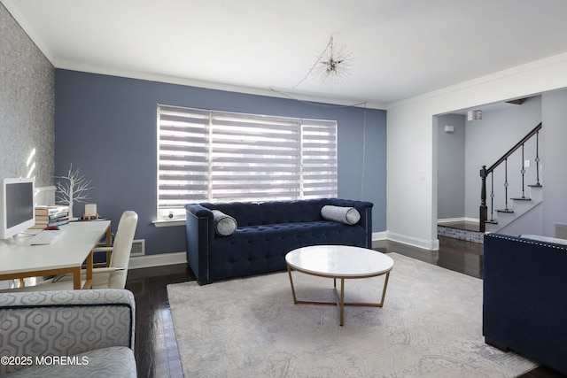 living area featuring stairs, ornamental molding, wood finished floors, and baseboards