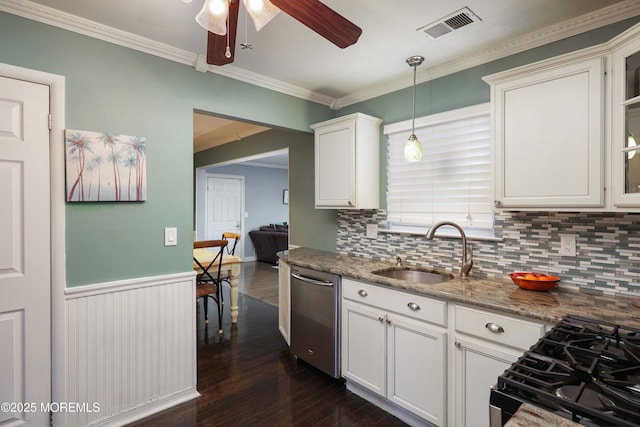 kitchen featuring visible vents, dishwasher, white cabinetry, a sink, and gas stove