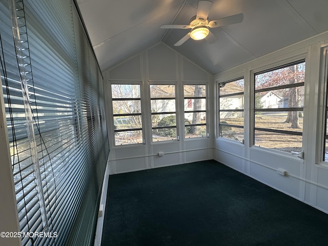 unfurnished sunroom with ceiling fan and vaulted ceiling