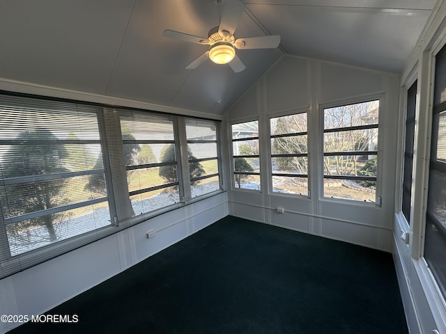 unfurnished sunroom featuring ceiling fan and vaulted ceiling