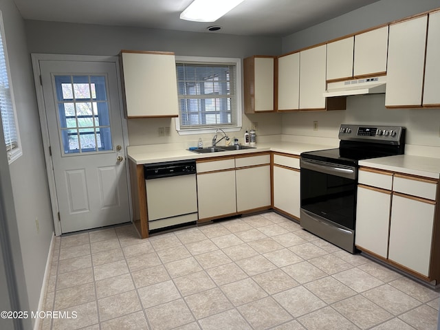 kitchen featuring light countertops, a sink, dishwasher, under cabinet range hood, and stainless steel electric range