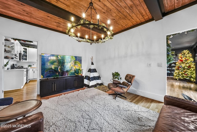 living area featuring a chandelier, wooden ceiling, beamed ceiling, and light wood finished floors