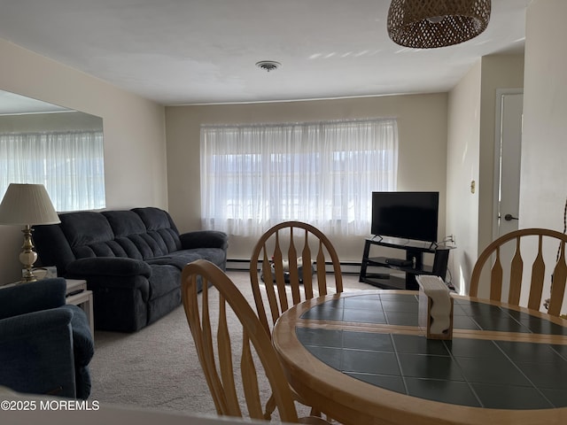 dining room featuring a wealth of natural light, light carpet, and visible vents