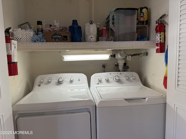 clothes washing area featuring laundry area and independent washer and dryer