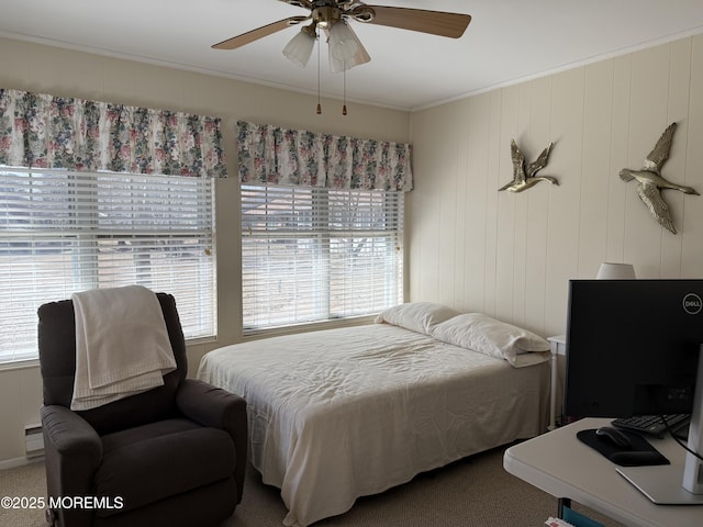 bedroom with ceiling fan, carpet flooring, and crown molding