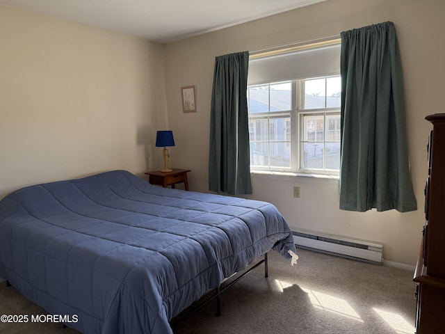 bedroom with carpet and a baseboard radiator