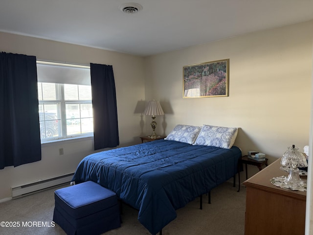 bedroom with light carpet, a baseboard radiator, and visible vents