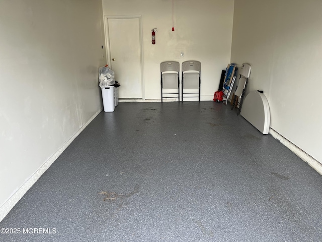 garage featuring baseboards