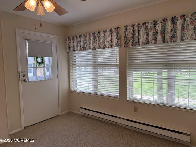 7B Cambridge Cir Unit B, Manchester, NJ 08759 - unfurnished dining area featuring a baseboard radiator, a ceiling fan, plenty of natural light, carpet floors, and ornamental molding