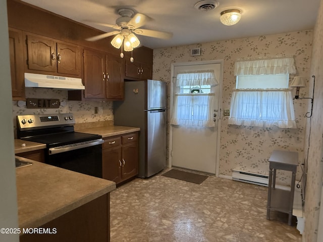 7B Cambridge Cir Unit B, Manchester, NJ 08759 - kitchen with appliances with stainless steel finishes, under cabinet range hood, a baseboard heating unit, a ceiling fan, and light countertops