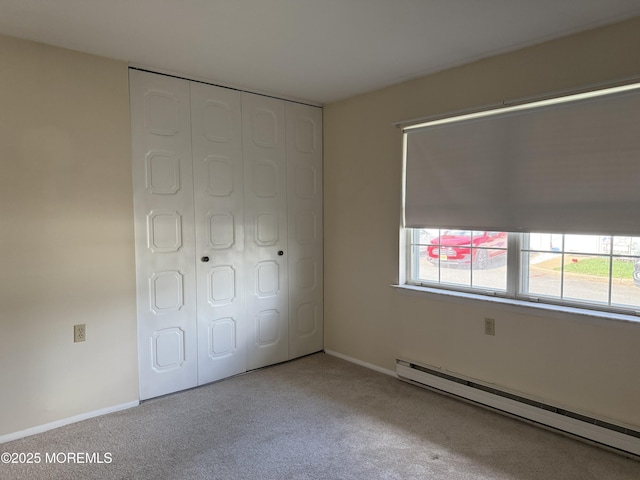 7B Cambridge Cir Unit B, Manchester, NJ 08759 - unfurnished bedroom featuring a baseboard radiator, carpet, and multiple windows