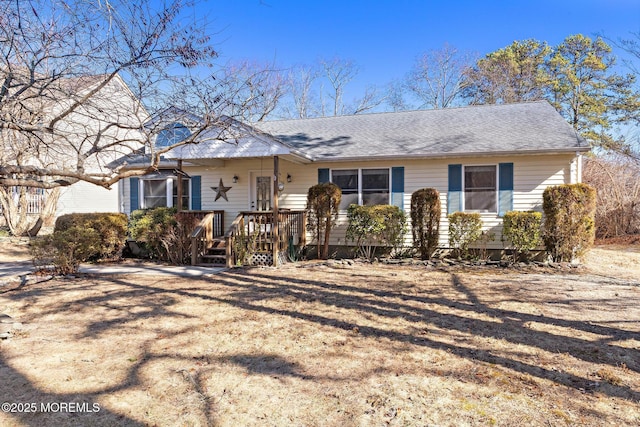 ranch-style house with roof with shingles