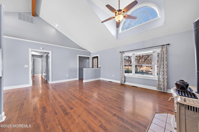 unfurnished living room with visible vents, ceiling fan, baseboards, and wood finished floors