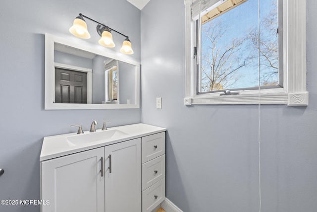 bathroom featuring vanity and baseboards