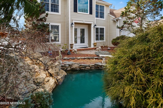 back of house with french doors