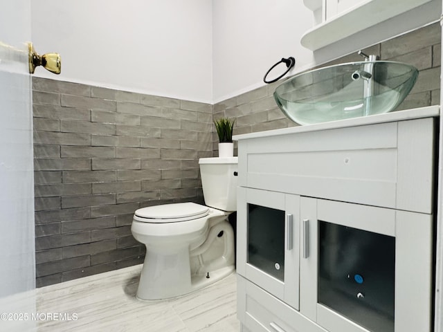 61B Hedge Dr, Lakewood, NJ 08701 - bathroom featuring wainscoting, toilet, vanity, and tile walls