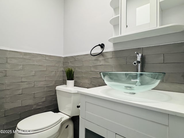 61B Hedge Dr, Lakewood, NJ 08701 - half bathroom featuring toilet, tile walls, wainscoting, and vanity