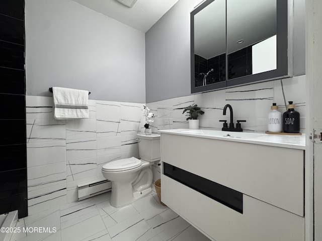 61B Hedge Dr, Lakewood, NJ 08701 - bathroom featuring toilet, marble finish floor, a baseboard heating unit, tile walls, and vanity