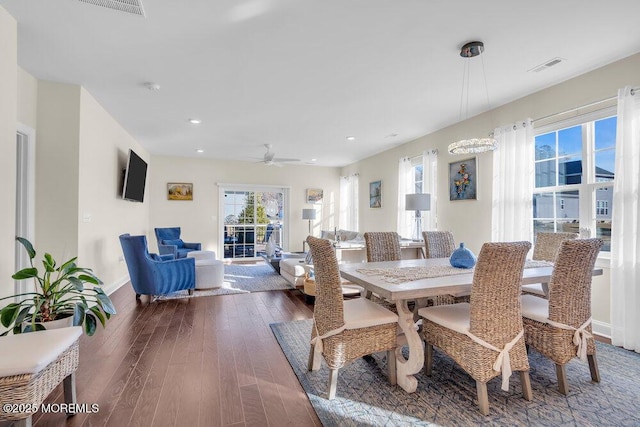 dining area with baseboards, visible vents, hardwood / wood-style floors, and recessed lighting