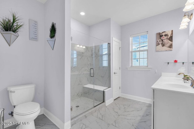 bathroom with marble finish floor, a marble finish shower, toilet, vanity, and baseboards