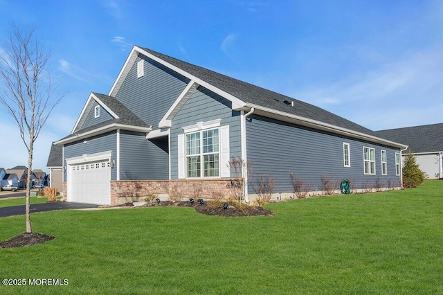 view of property exterior with a yard, aphalt driveway, an attached garage, and stone siding