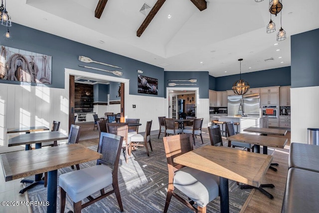 dining room featuring visible vents, high vaulted ceiling, and beamed ceiling